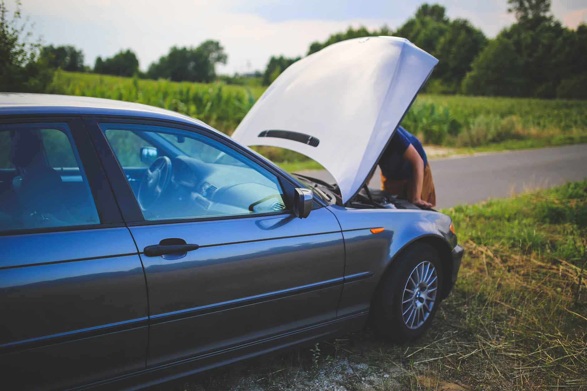 A broken car near the road 